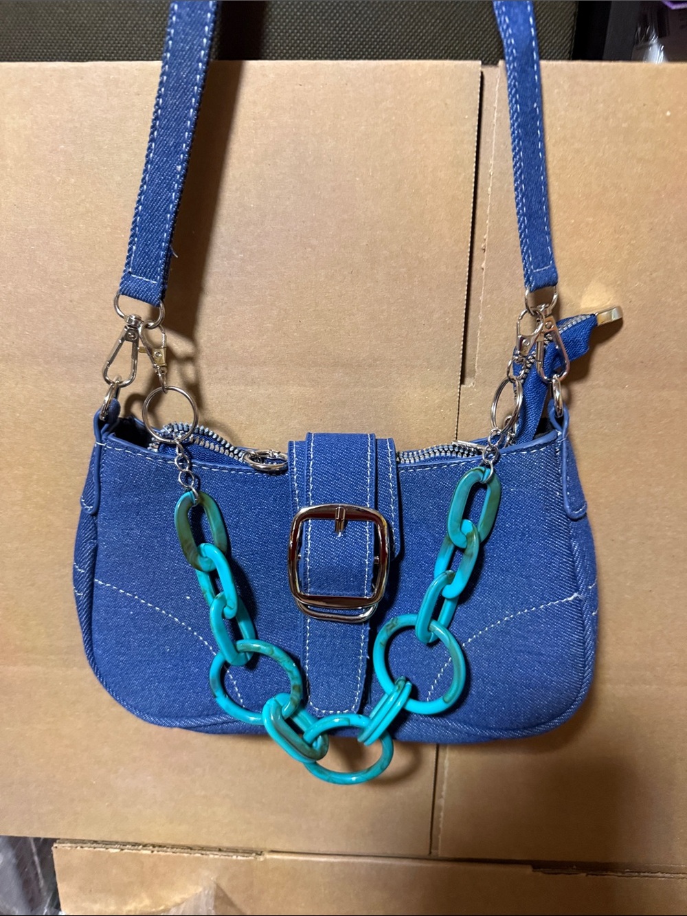Blue Denim Shoulder Bag with Teal Chain Accent bag not for sale